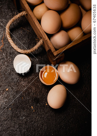 Fresh chicken eggs in carton egg tray or wood boxes 67405638