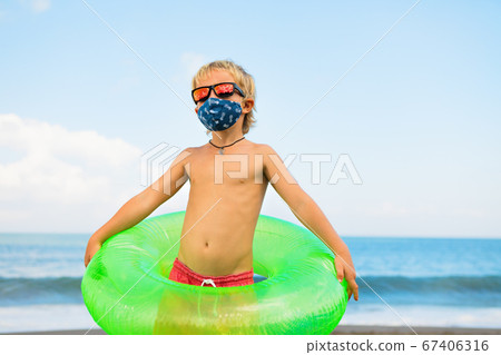 Funny child in sunglasses, protective face mask on Funny child in sunglasses, protective face mask on 67406316
