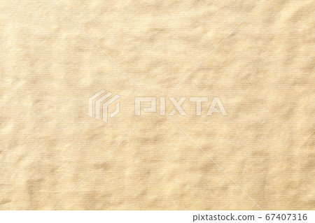 Crumpled brown paper background texture Crumpled brown paper background texture 67407316