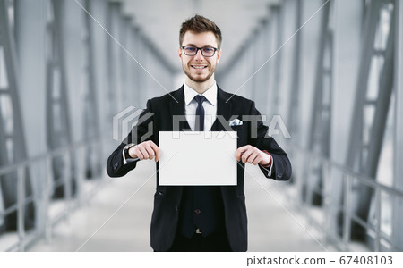 Man holding empty signboard at international airport Man holding empty signboard at international airport 67408103