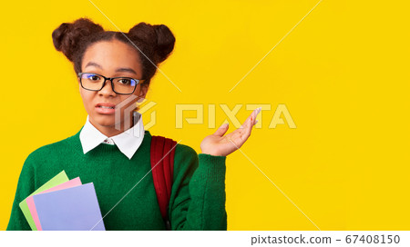 Doubtful skeptical black teen girl shrugging shoulder Doubtful skeptical black teen girl shrugging shoulder 67408150