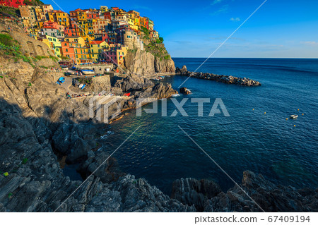Colorful buildings on the cliffs in Manarola village, Liguria, Italy Colorful buildings on the cliffs in Manarola village, Liguria, Italy 67409194