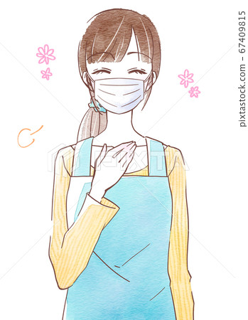 Young woman with a relieved expression wearing a mask and apron 67409815