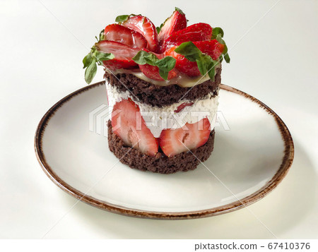 strawberry and chocolate cake on a table strawberry and chocolate cake on a table 67410376