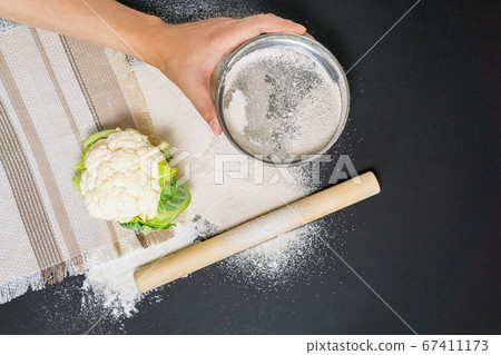 gluten free baking, vegetable cauliflower. Alternative to wheat flour for keto paleo diet concept gluten free baking, vegetable cauliflower. Alternative to wheat flour for keto paleo diet concept 67411173