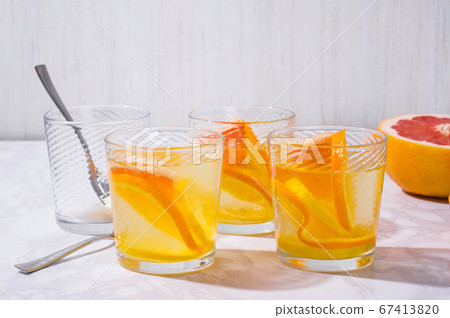 citrus lemonade ingredients on white table. Fresh citrus lemonade ingredients on white table. Fresh 67413820