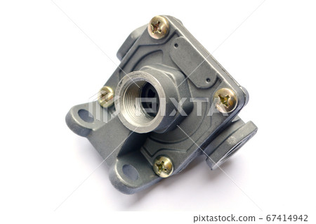 Quick release valve of the truck's pneumatic brake system on a white background. Spare parts. Quick release valve of the truck's pneumatic brake system on a white background. Spare parts. 67414942