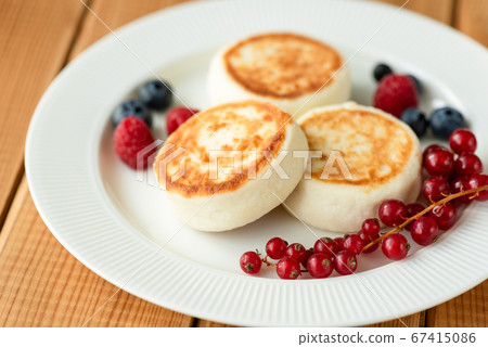 Russian Syrniki, Cottage cheese fritters or 67415086