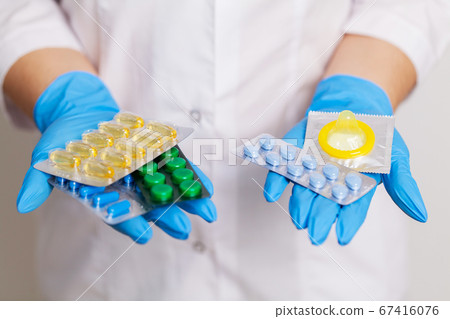 Doctor holds a pill for men's sexual health Doctor holds a pill for men's sexual health 67416076