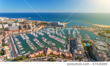 Aerial photo of the bay, Vilamoura, Quarteira, Portugal. Marina with luxury yachts. Aerial photo of the bay, Vilamoura, Quarteira, Portugal. Marina with luxury yachts. 67416840