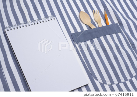 Cutlery and pencils in notebook and apron pockets 67416911