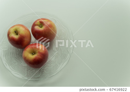 Jazz apple on a glass plate Jazz apple on a glass plate 67416922