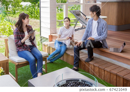 Young people relaxing in the rental space in the countryside Young people relaxing in the rental space in the countryside 67421049