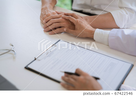 Patient receiving bad news, he is desperate and Patient receiving bad news, he is desperate and 67422546