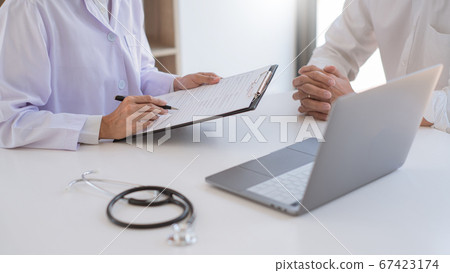 doctor giving consulting and diagnostic to patient doctor giving consulting and diagnostic to patient 67423174