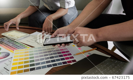 Creative team analyzing prototype products for Creative team analyzing prototype products for 67423175