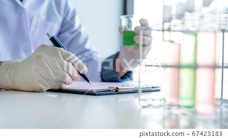 scientists researching in laboratory in white lab scientists researching in laboratory in white lab 67423183
