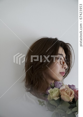 Portrait of woman with flowers 67423953