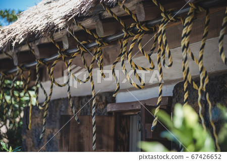 The scenery of the rope tied on the roof inside Seongeup Folk Village in Jeju Island, South Korea. 67426652