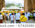 Umbrellas decorated with leaves in Kathin ceremony. 67426980
