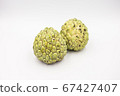 Two custard apples placed on a white ground. 67427407