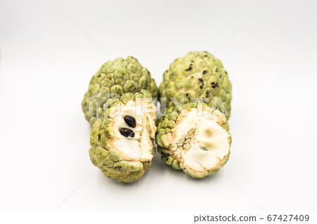 Four custard apples placed on a white ground. Four custard apples placed on a white ground. 67427409
