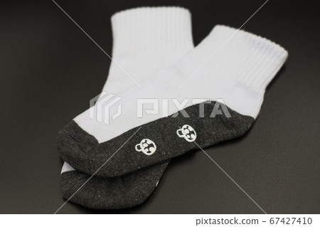 One pair of socks on a black background. One pair of socks on a black background. 67427410