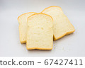 Three slices of bread on a white background. 67427411