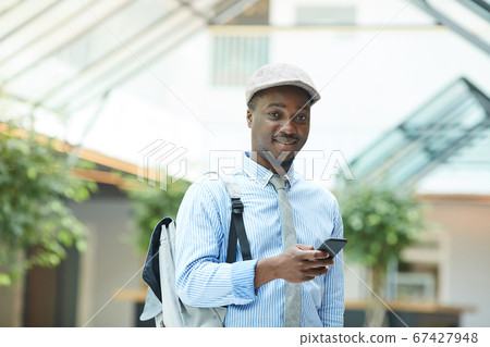 African businessman using mobile phone 67427948