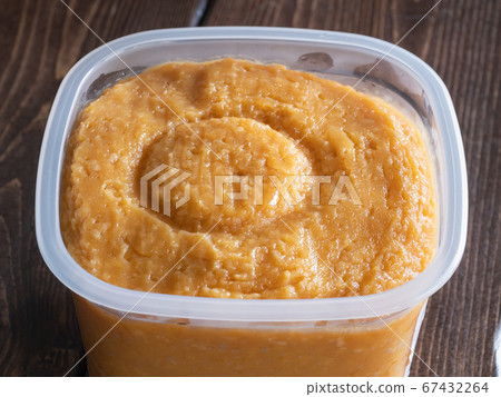 Miso of fermented food in a container. Miso of fermented food in a container. 67432264