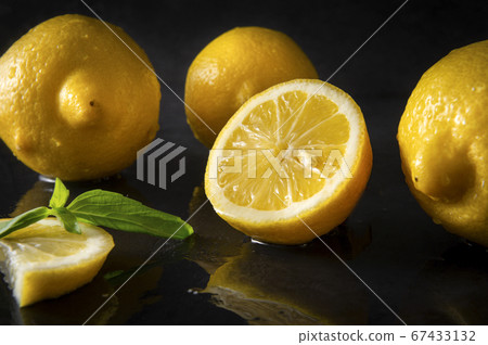 lemons on a wet black with reflection , citrus, lemons on a wet black with reflection , citrus, 67433132