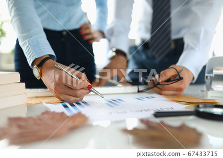 Businessman and businesswoman in office analyze autumn plan. Businessman and businesswoman in office analyze autumn plan. 67433715