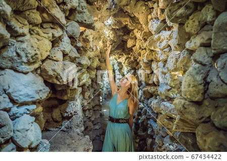 Woman tourist in Chua Tu Van temple made of shells and corals or the dragon maze. Travel to Vietnam Concept Woman tourist in Chua Tu Van temple made of shells and corals or the dragon maze. Travel to Vietnam Concept 67434422