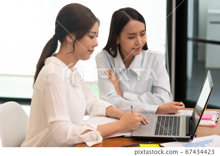 Asian business man and women meeting and talk about job in office. Asian business man and women meeting and talk about job in office. 67434423