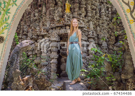 Woman tourist in Chua Tu Van temple made of shells and corals or the dragon maze. Travel to Vietnam Concept 67434486