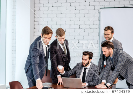 togetherness and partnership of business men at work 67434579