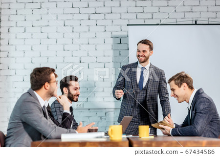 young boss with colleagues in office 67434586