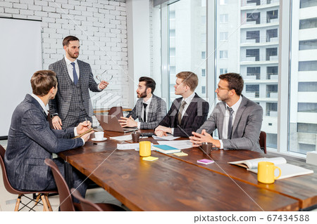 teamwork of business men in tux 67434588