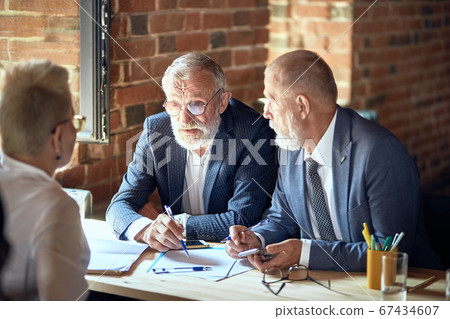 Businessmen work in office Businessmen work in office 67434607