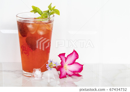 herbal healthy drinks cold strawberry juice with pink flower and iced of lifestyle in summe herbal healthy drinks cold strawberry juice with pink flower and iced of lifestyle in summe 67434732
