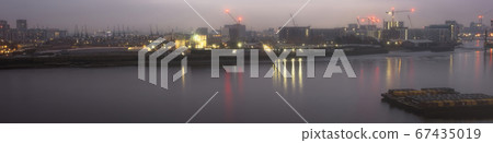 London River Thames panoramic sunset view taken from North Greenwich, UK 67435019
