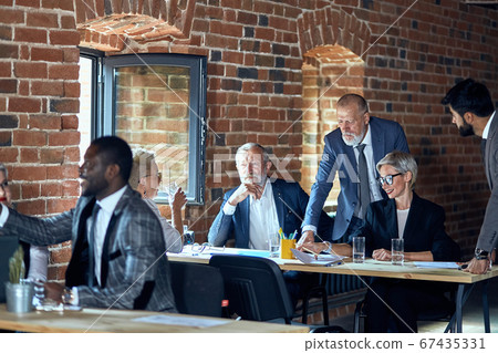 Businessmen work in office 67435331