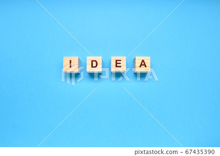 IDEA word written in dice on a blue background IDEA word written in dice on a blue background 67435390