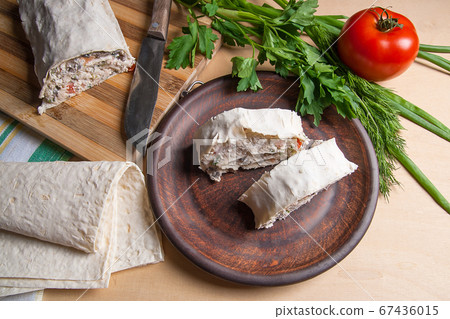 Two pieces of pita bread or lavash roll with Two pieces of pita bread or lavash roll with 67436015