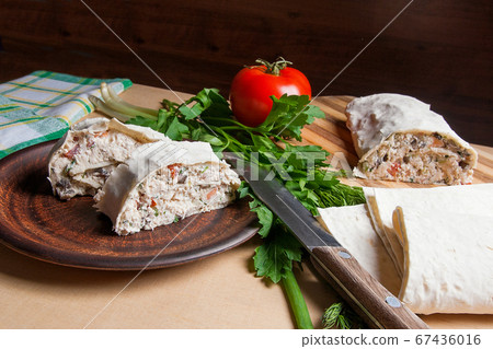 Two pieces of pita bread or lavash roll with Two pieces of pita bread or lavash roll with 67436016