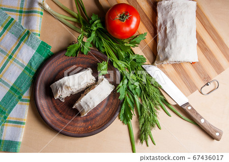 Two pieces of pita bread or lavash roll with Two pieces of pita bread or lavash roll with 67436017