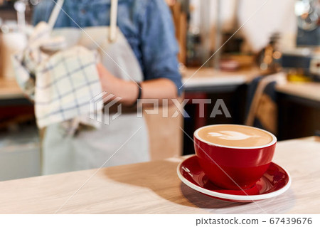 Beautiful cup with hot coffee Beautiful cup with hot coffee 67439676