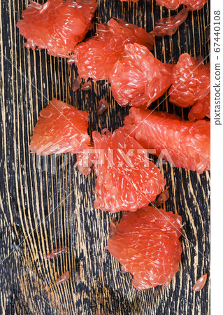 a piece of peeled grapefruit a piece of peeled grapefruit 67440108