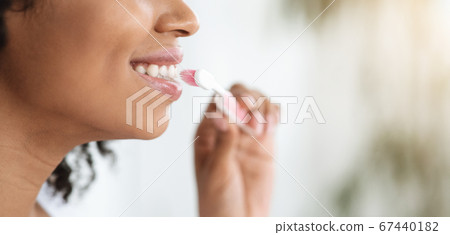 Oral Hygiene. Closeup Of Black Woman Brushing Her Perfect White Teeth Oral Hygiene. Closeup Of Black Woman Brushing Her Perfect White Teeth 67440182
