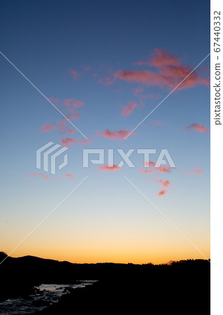 Orange sky and magenta clouds at dawn Orange sky and magenta clouds at dawn 67440332